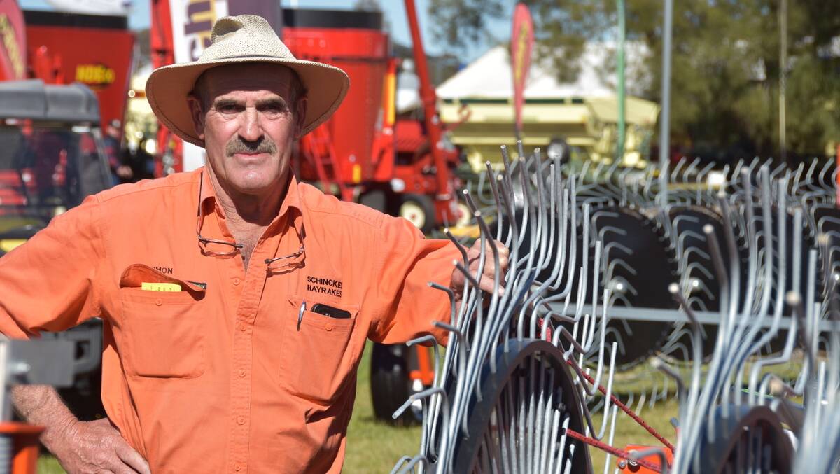 MACHINE OF THE YEAR: Naracoote SA manufacturer, Simon Schinckel with his Next F series hay rake, which was awarded the coveted Henty Machine of the Year award at the Henty Machinery Field Days. 