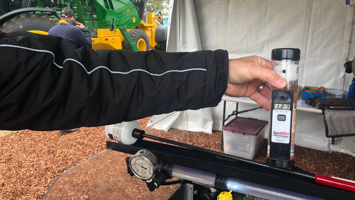 John Deere spray calibrator for checking nozzle output.