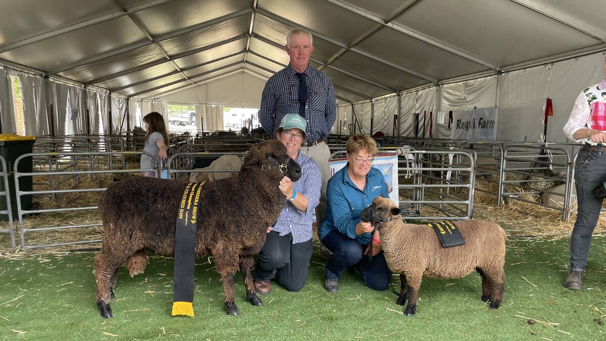 Champion Black and Coloured ram shown by Melissa Henry, Young, with judge Ric Houlihan, Glen Esk Corriedales, Rydal, and the champion Black and Coloured ewe shown by Jennie Curtis, Bywong.