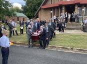 Merino breeders formed a guard of honour as the casket left the church.