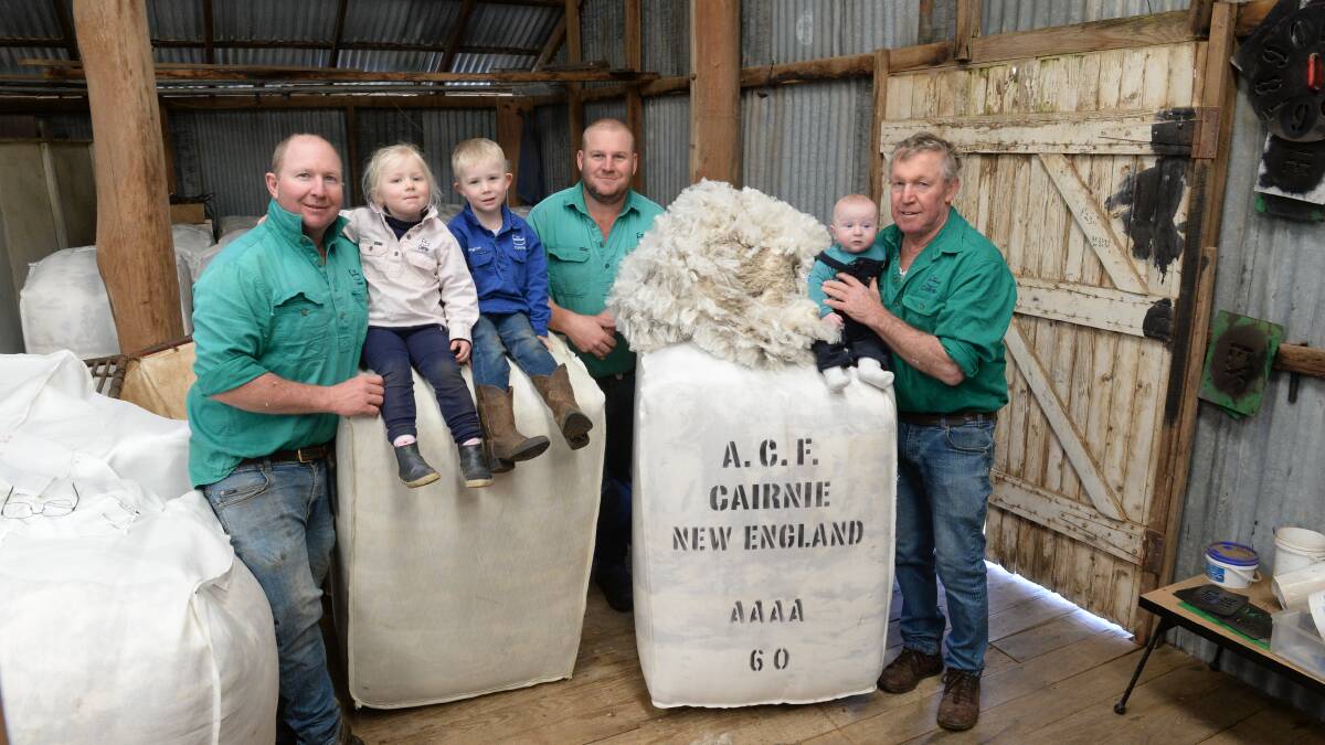 Another generation in the woolshed at Cairnie, Walcha - Jock Fletcher with his children, Grace and Angus, Ross Fletcher and Warwick Fletcher with his grandson, Fletcher Pendelton, son of Warwick's daughter Holly.