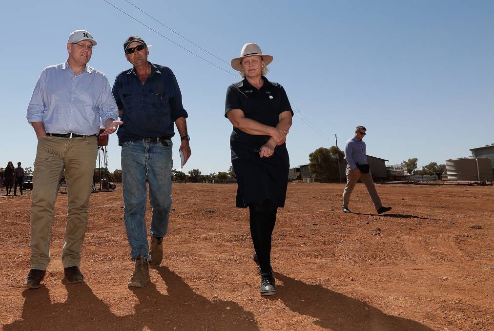Prime Minister Scott Morrison speaks with with graziers Stephen and Annabel Tully at Quilpie, in South West Queensland last month.