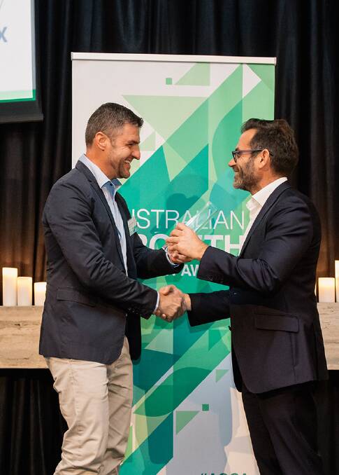 Maxum Foods' Ben Woodhouse collects the business growth award from Maurizio Marmotta, the sales general manager with Australian Growth Company Awards sponsor, GlobeX.
