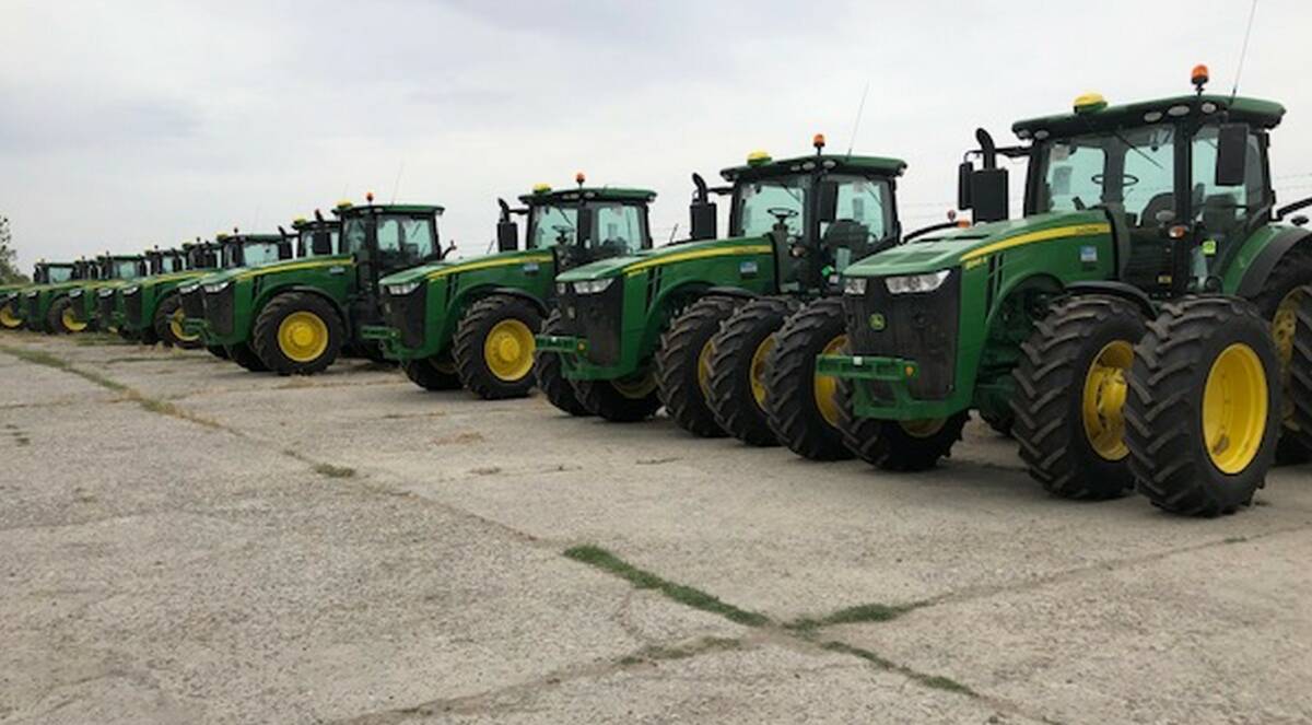 Some of the 30 GPS-guided John Deere R8 tractors now used by Indorama.