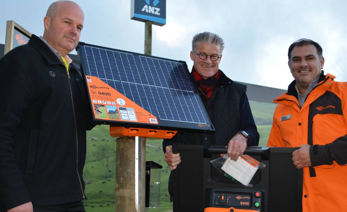 Gallagher’s animal management marketing manager, Mark Harris, with Australian general manager, Malcolm Linn and South American business development manager, Gonzalo Andersen with a new, portable S400 integrated solar powered energiser mounted at New Zealand's national Fieldays.
