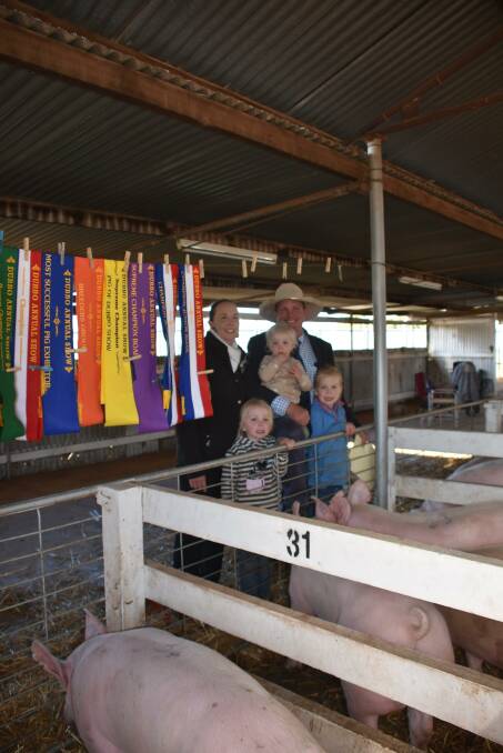 Pinedock pig stud's Jane and James Dockrill with their daughters Ruby, 5, Paige, 2 and Millie, 6, at the Dubbo Show. Photo: Hannah Powe
