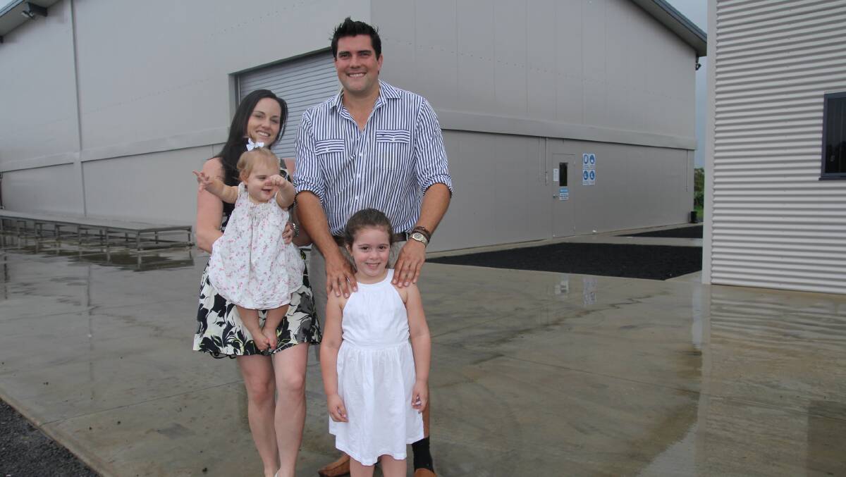 Rob and Krista Watkins, and their daughters Kira and Kate, outside their new Natural Evolution factory at Walkamin on the Atherton Tablelands.