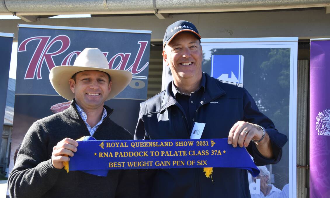 GOOD JOB: Palgrove Pastoral Company's business development and genetics manager Ben Noller collects a first place ribbon for weight gain in the Paddock to Palate competition from Rabobank's Mal Porter.