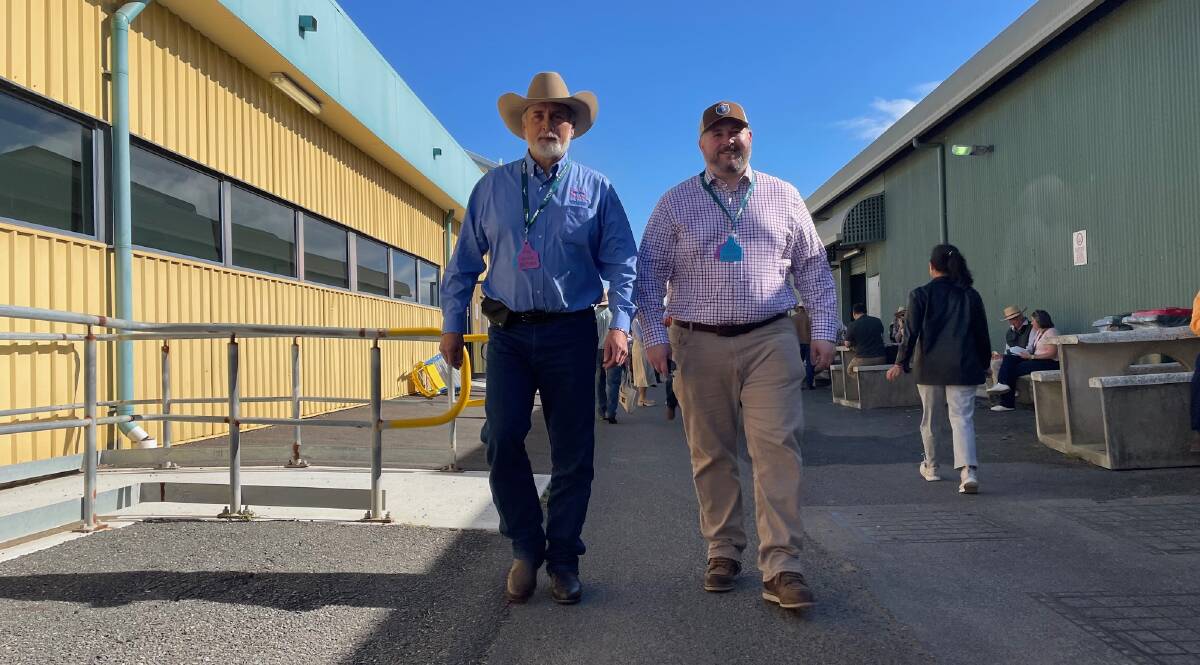 President of the US National Cattlemen's Beef Association, Wyoming cattle rancher Mark Eisele and the organisation's executive director of government affairs Kent Bacus walking the grounds of Beef Australia. Picture Shan Goodwin 