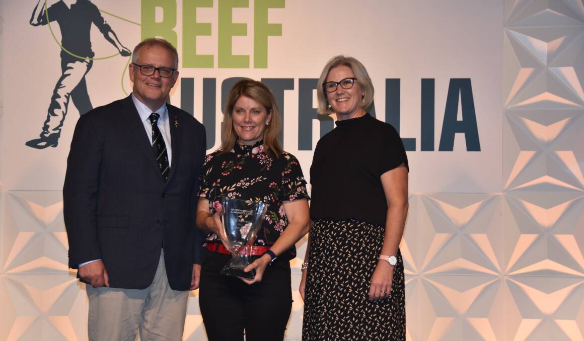 HONOURED: Prime Minister Scott Morrison with the 2021 Queensland Country Life Beef Achiever Tracey Hayes and Australian Community Media's national agriculture news editor Penelope Arthur. 