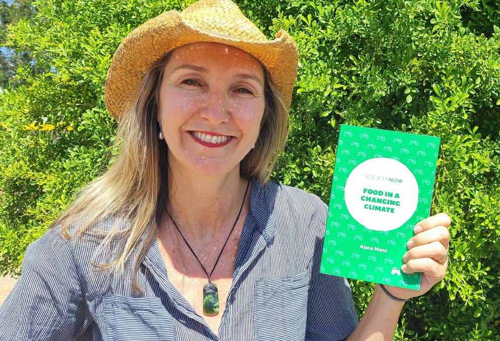 NEW FOCUS: Associate Professor Alana Mann, from the Sydney Environment Institute at the University of Sydney, with her new book on the way food is produced. Image: Edwina Pilch
