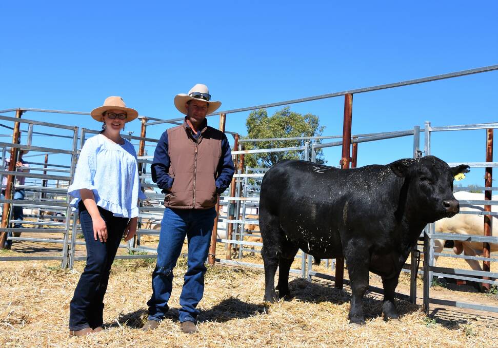 SALE TOPPER: Bauhinia Park Rito Q542 sold for $22,000, pictured with Bindi Nalder, Bauhinia Park Charolais & Angus, Emerald, with new buyer Mick Busby, Star Downs, Alpha.