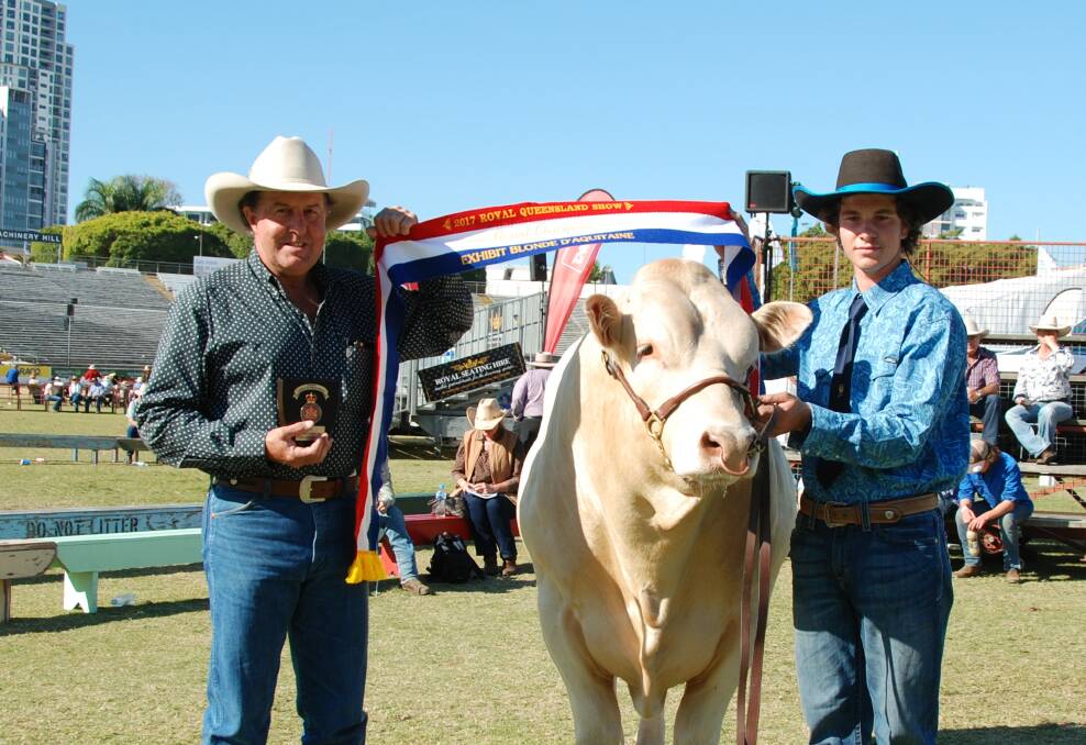 Peter and Luke Aisthorpe, Monal Blondes, Monto with their grand champion exhibit Meridan Lawson.
