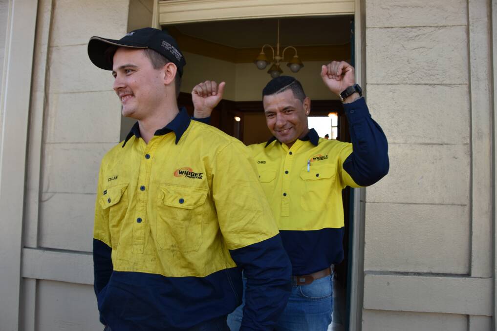 Widgee Engineering workers celebrate as they leave Gympie Regional Council town hall on Thursday.