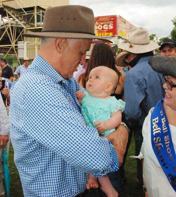 Prime Minister Malcolm Turnbull holding 5-month-old Grace Raven during his visit to Bell Show on Queensland's Western Downs.