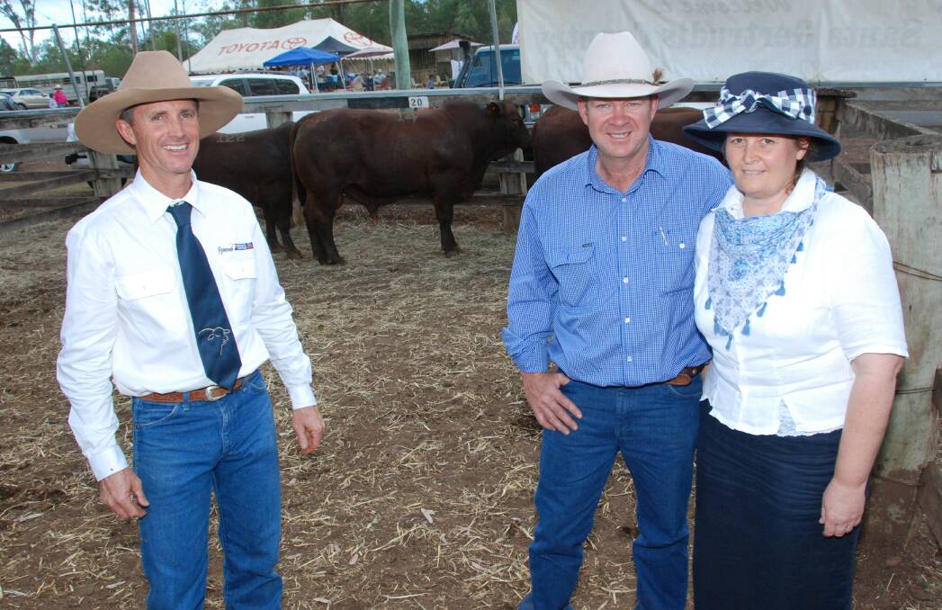 Rick Greenup, Greenup Eidsvold Station with top price bull buyers Brendan and Fiona Kemp, Carramah, Capella.