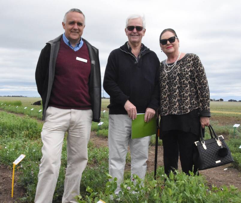 Garry Rosewarne, of Agriculture Victoria, shows Minyip couple Paul and Barbara Stratmann around the Heritage Varieties trial site at the Grains Innovation Park open day last week.