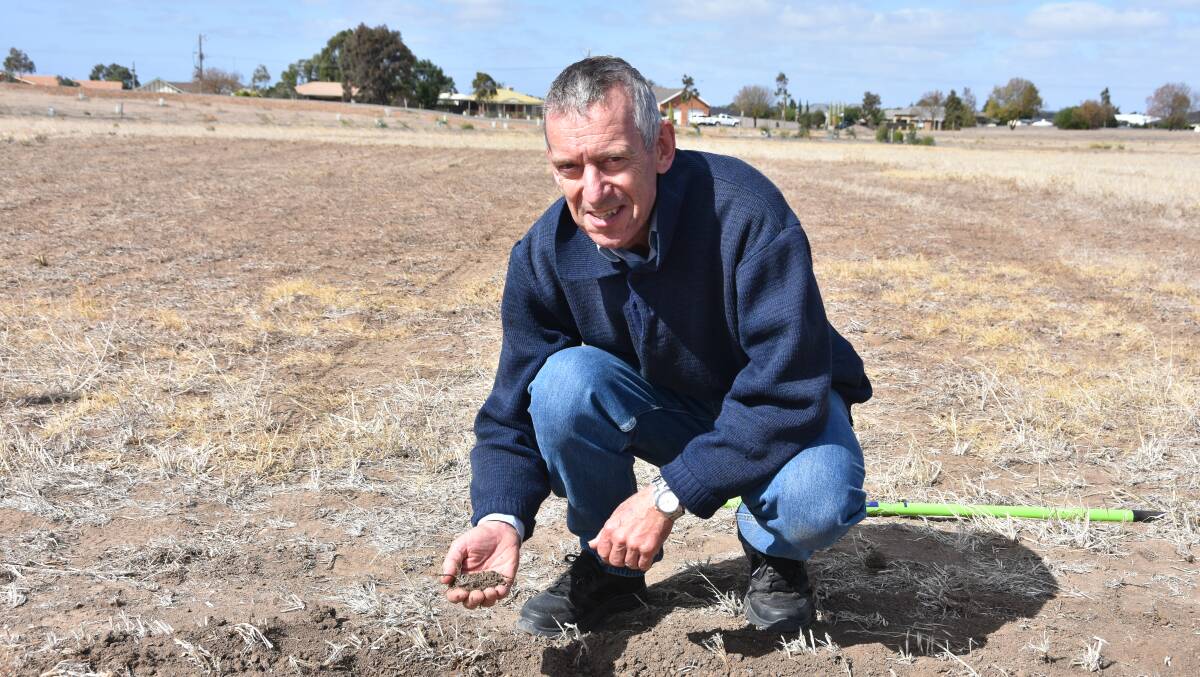 Tony Fay, Agriculture Victoria, demonstrating how soil erosion works with different sized pieces of soil.