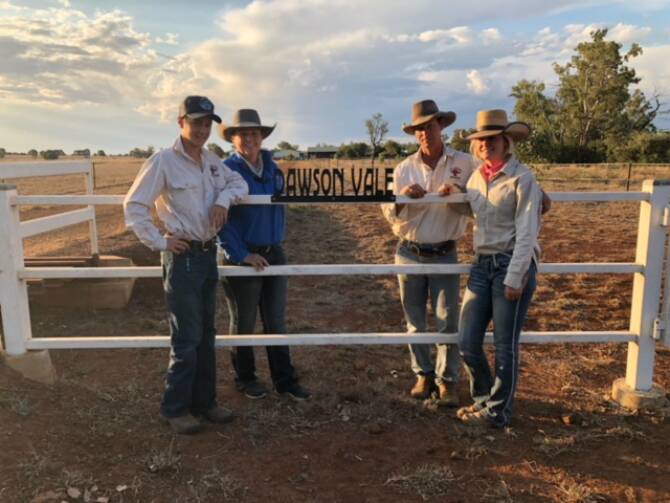 At home: Reegan, Jaiden, Peter and Jackie Hill at the the front gate of Dawsonvale, in Taroom, which they've been successfully managing for four years.