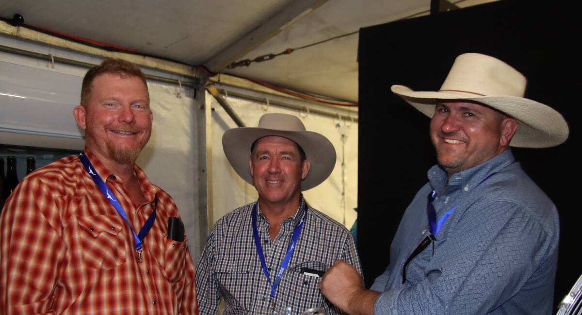 Great week: Droughtmaster directors Will Haviland and Ken McKenzie sharing a laugh with president Todd Heyman in the Droughtmaster marquee.