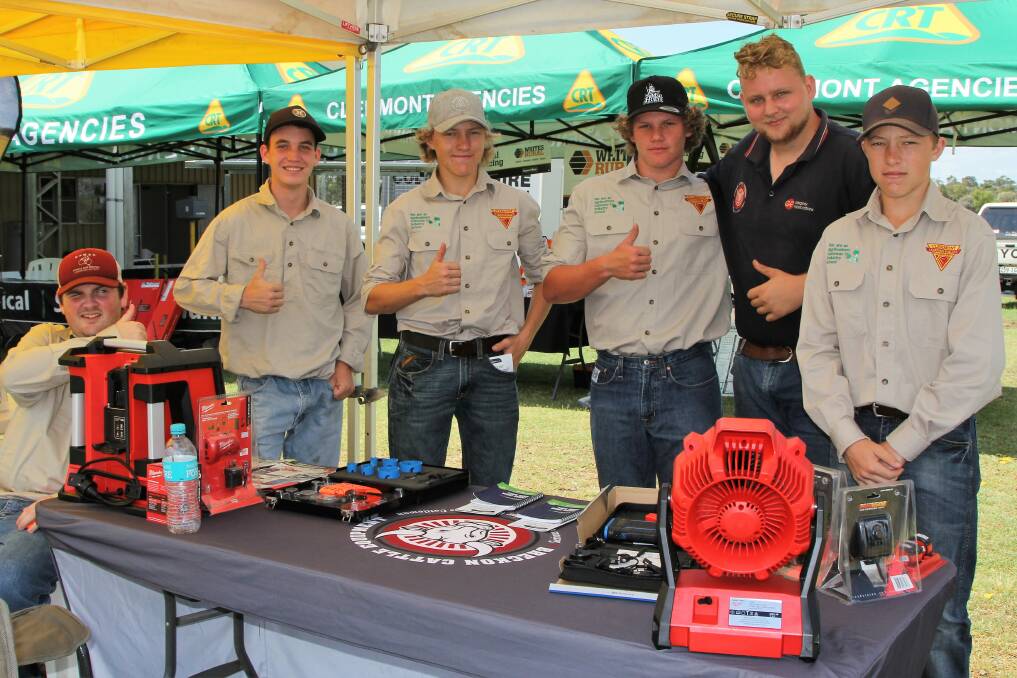 Inspection: Clermont State High School students, Aiden Jeffery, Corey Verrall, Mackinley Ryder, Hayden Olzard and McCauley Ryder, with Gregory Fabrications' Thomas McMillan in the trade display at the 2018 expo.