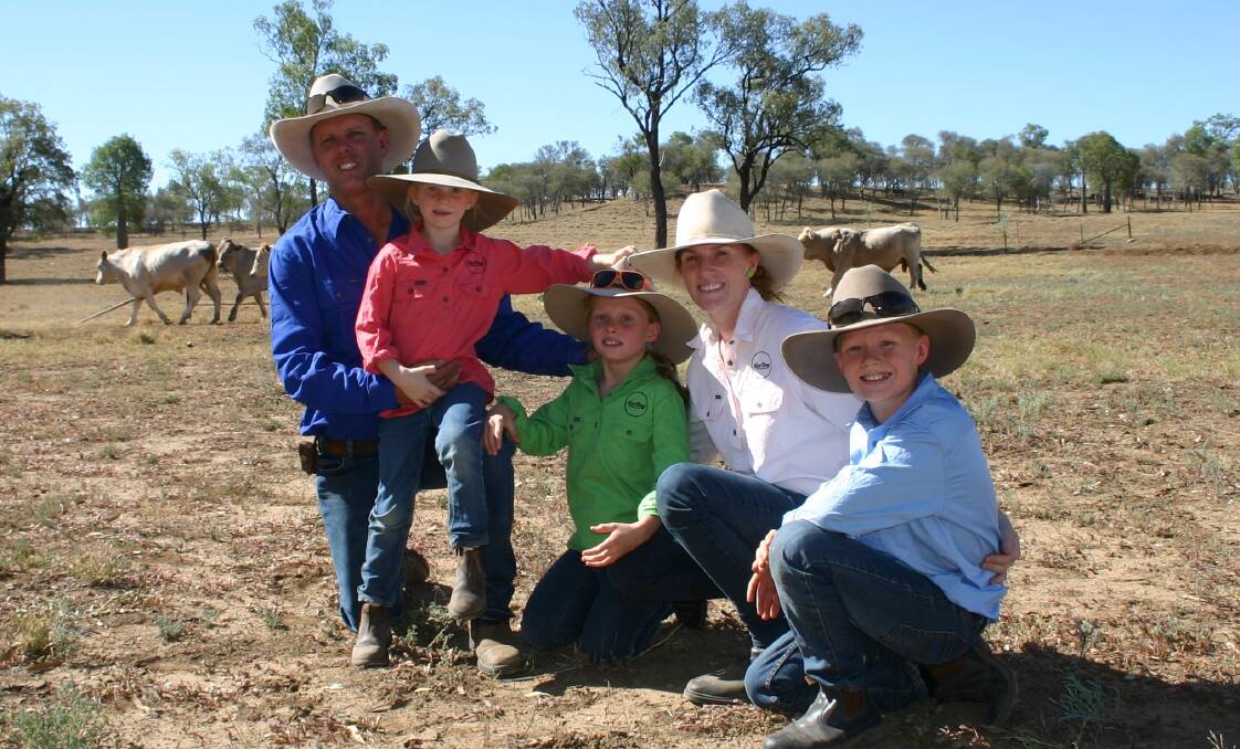 The Cameron family: Doug and Rachelle Cameron at Nive Downs with their children Ella, Grace and Stirling and their steers.