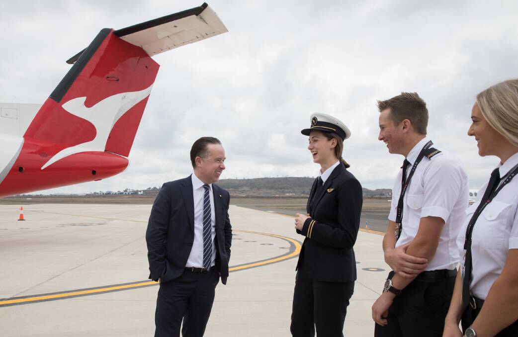Qantas Group CEO Alan Joyce and QantasLink pilot Emily Bee, with two aviation students from the University of Southern Queensland.