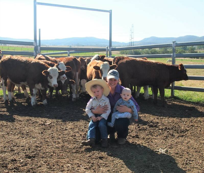 Home: Megan Fogg, Ryland and Lucas Fogg on-property with some of their weaners which are usually sold through the Shepherdson & Boyd Toogoolawah Weaner Sale.