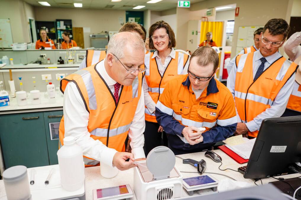 Prime Minister Scott Morrison tries his hand at AdBlue quality assurance testing during a recent visit to Incitec Pivot's Gibson Island plant near Brisbane. Photo: Jared Vethaak