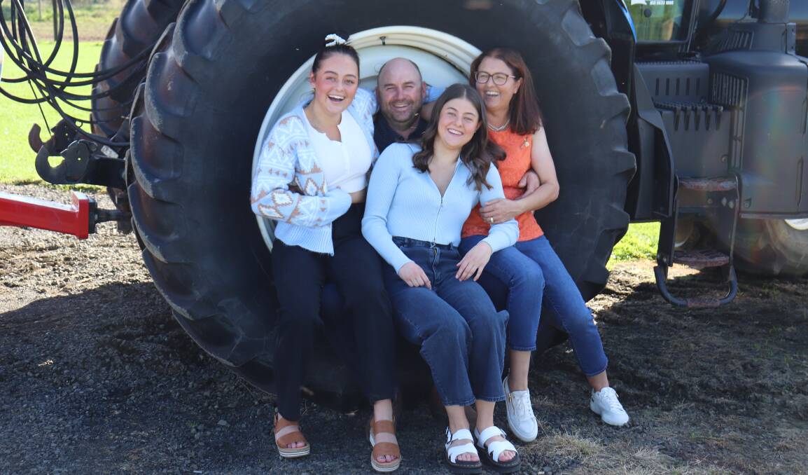 Dairy devastation: Hayden and Rachael Finch, Denison, pictured with daughters Emily and Georgia, sold two properties and their 950-head milking herd following the Fonterra milk price scandal in 2016. 