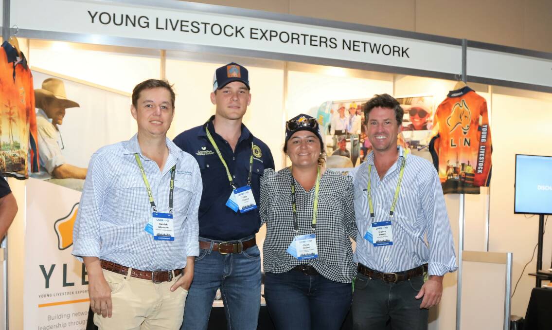 The new Young Livestock Exporters Network executive.- Hamish Shannon, Ollie Thorne, Chloe Grant and Munro Hardy, along with Hugh Dawson in the image behind them, manning their stall at the Darwin conference. Picture: Sally Gall