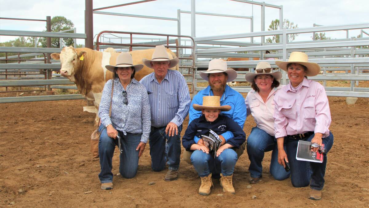 Jenny and Rowly Walker, Mitchell, with Andrew, Claire and Emma Walker, Hannaford, purchasers of the top priced bull, and Lis Skene, Meldon Park stud principal. Photo: Sally Gall