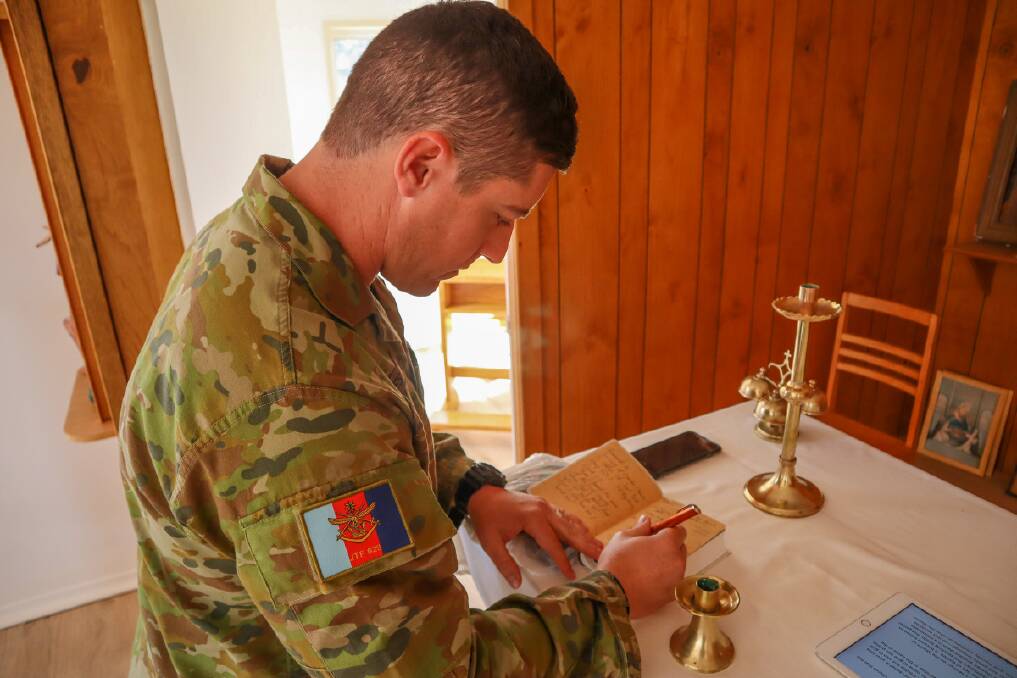 Australian Army soldier Corporal Anthony Symes from the 11th Engineer Regiment in the Catholic Church in Windorah.