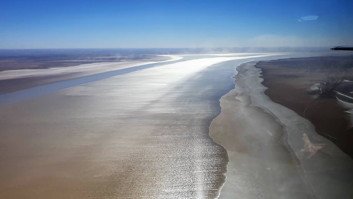 The last of the Cyclone Trevor floodwater flowing down the Warburton Groove into Lake Eyre. Outflows from evaporation are now matching inflows, according to the Bureau of Meteorology.