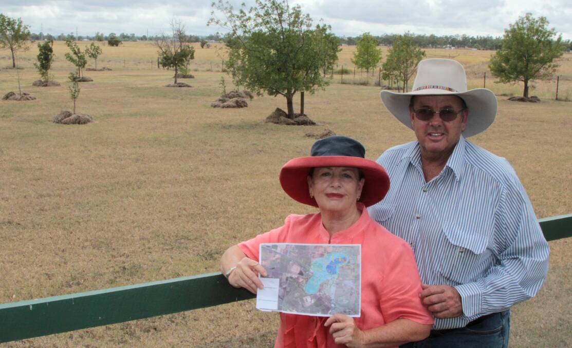 Mapped out: Di Priddle and David Jefferis, Berwick Stud, Oakey with one of the Department of Defence maps showing the extent of possible contamination. Picture: Sally Cripps.