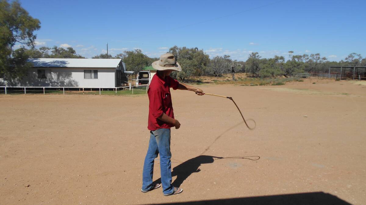 A participant tests out the whip he made.