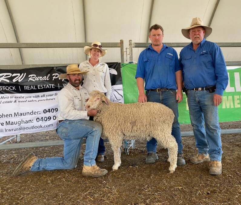 The top priced ram, sold to Norm and Pip Smith, Glenwood Merinos, Wellington NSW for $10,200, pictured with Stephen Munder and Clare Maughan, LRW Rural Pty Ltd, and Luke and Mark Murphy, Karbullah Poll Merinos. Photo supplied.
