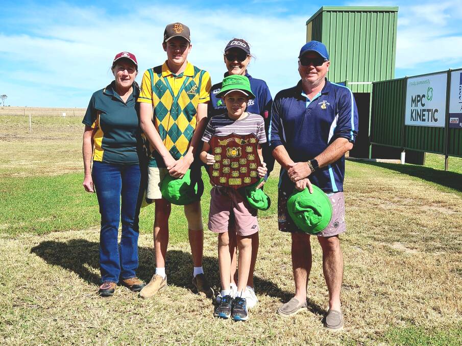 Paw Paw Club coordinator Julie Allan with the Brandt family from the Tambo club, proudly holding the Paw Paw teams challenge trophy. Picture: Sally Gall