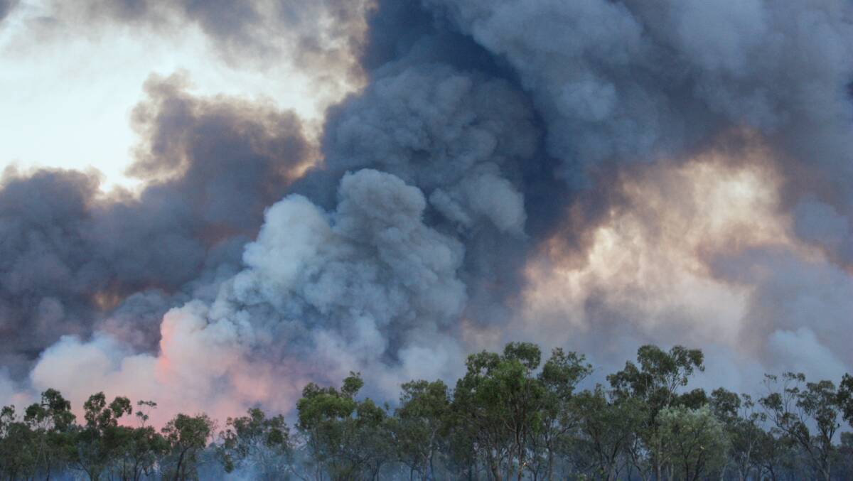 Fire taking hold in the Yalleroi district north of Blackall late in 2012. Picture: Ashley Adams