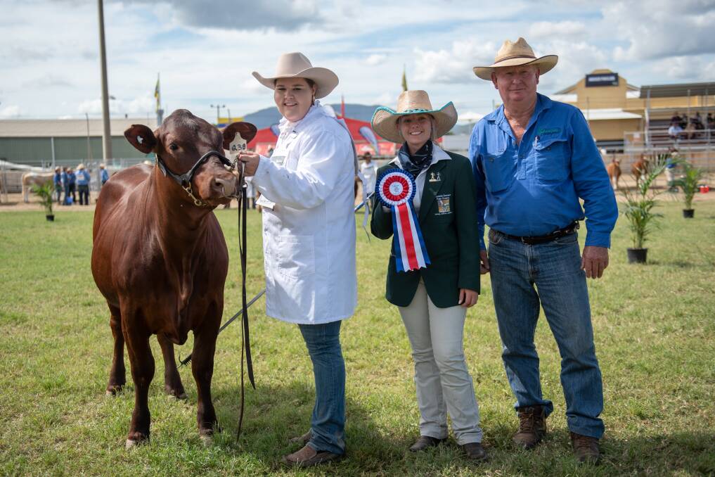 Kate Louden, Select Fitting, leads grand champion Senepol female, Planchonella Hill Quenten, with associate judge Yasmin Carley, and owner Tony Baker.