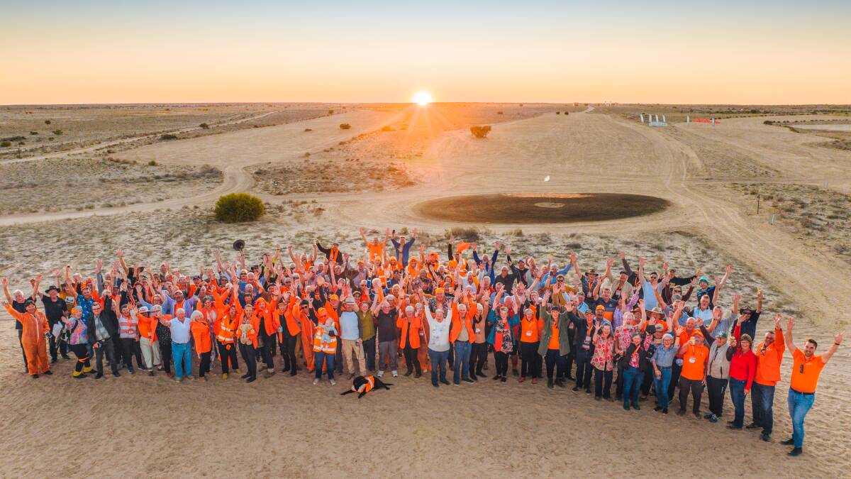Participants in 2022 gather for a group photo on the course at Birdsville.