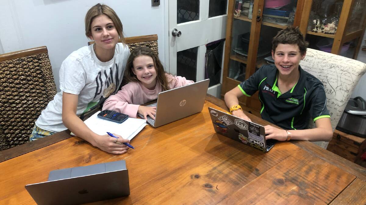 Abbie, Bronte and Sam Pratt doing their schoolwork from home at Julia Creek. Picture supplied.