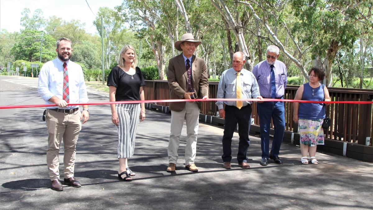 Maranoa Regional Council mayor Tyson Golder, third left, along with councillors Cam O'Neill, Joh Hancock, George Ladbrook, Geoff McMullen and Julie Guthrie, cut the ribbon to open the renewed Riggers Road Bridge. Picture: Sally Gall