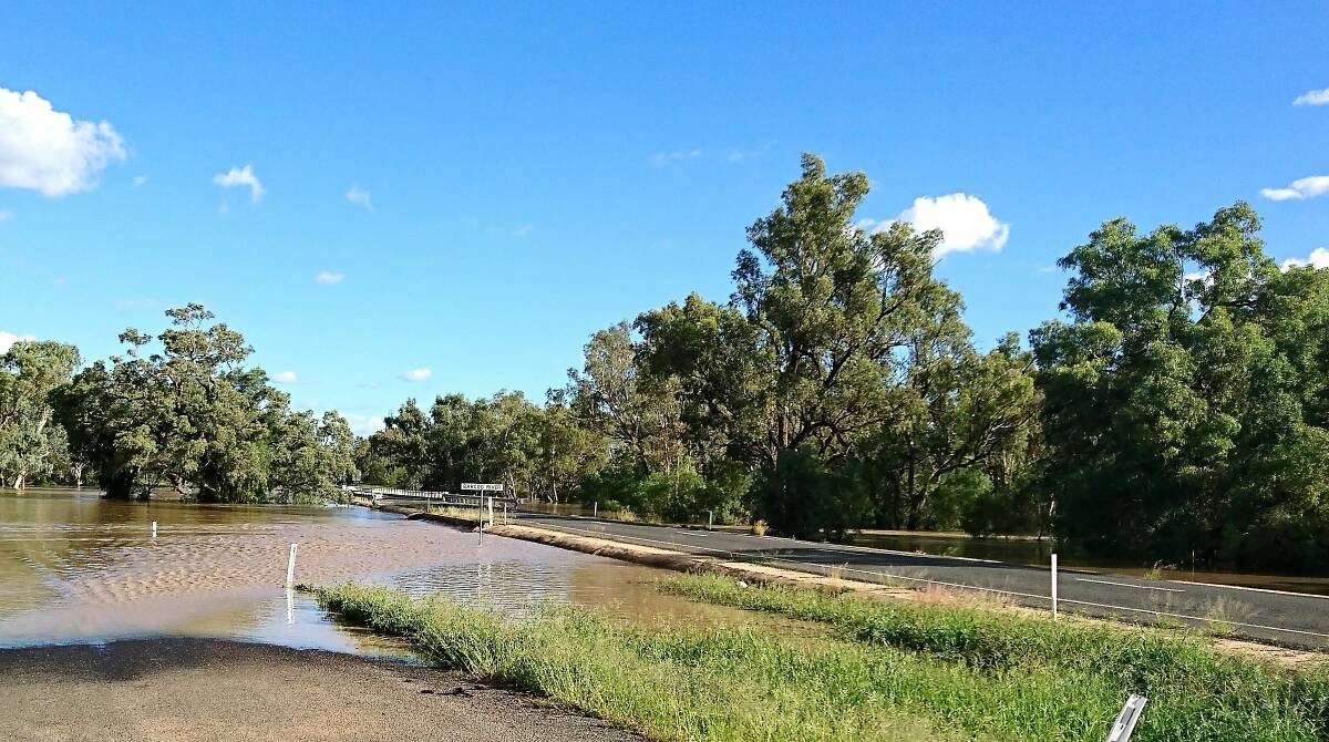The Barcoo River was lapping the bridge on the Landsborough Highway 60km north of Tambo by Sunday afternoon.