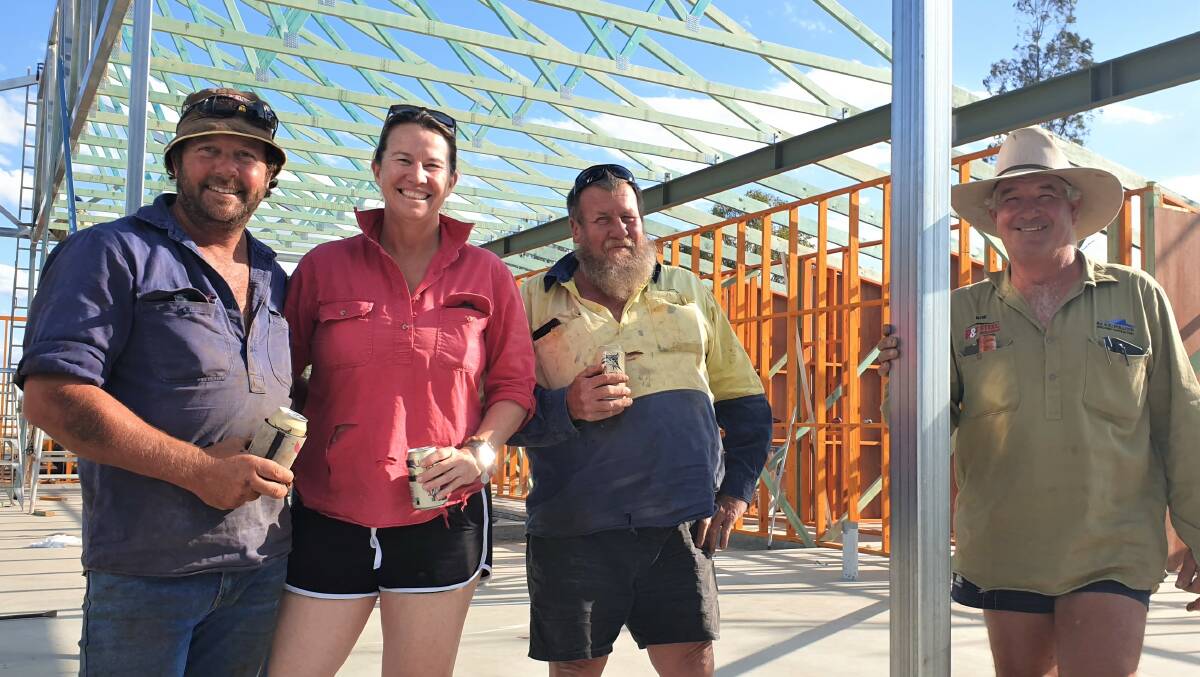 Friday drinks: There might not be a bar yet but Marty and Kristy Coomber were toasting the Mucka Pub's rebuild progress with machinery supplier Dave Carney while builder Rob Pollock stopped for a photo. Picture: Sally Gall.
