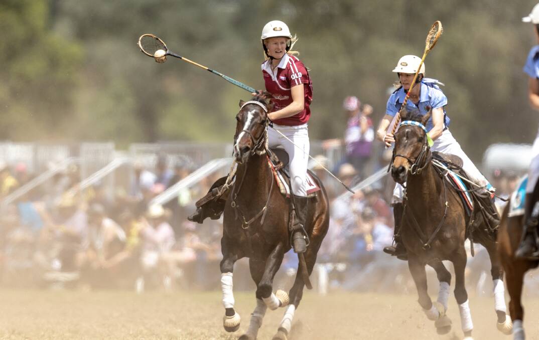 Tansey's Beth Hafey taking the ball up in a polocrosse game at the national championships. Photo - Justine Rowe.