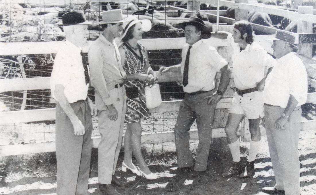Fred and Daphne Rich conferring with agents at a Blackall cattle sale in days gone by.