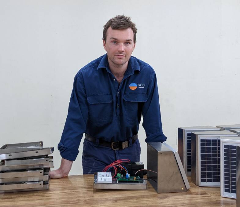 Cameron Sheales with some of the smart modules at the OPS headquarters in Longreach. Picture supplied.