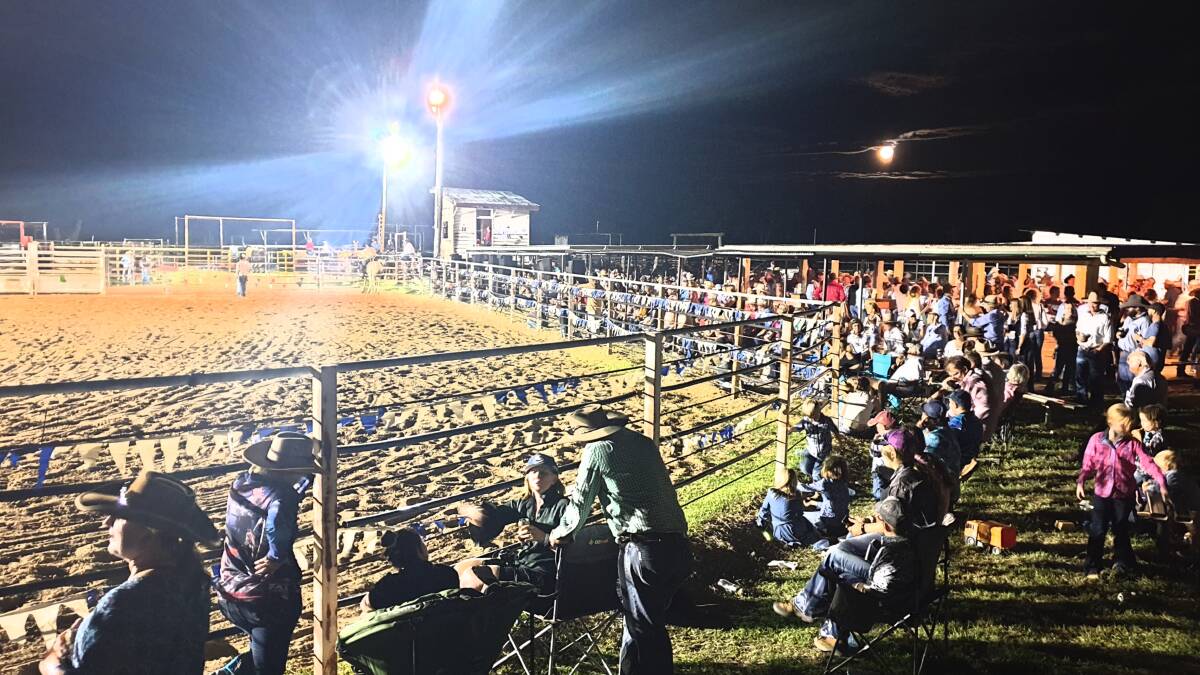 The New Year's Eve full moon shines down on the 600-strong crowd enjoying the Tooloombilla Bulls and Broncs night.