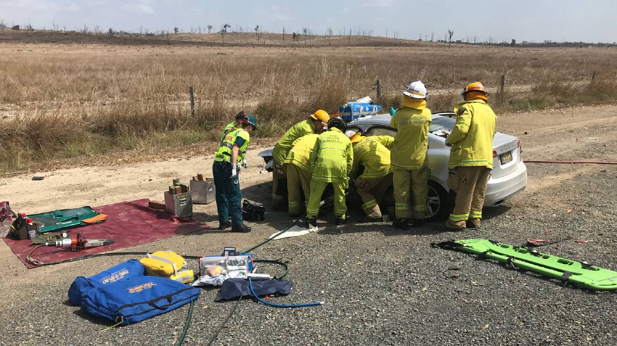 QFES officers at work at the scene of the accident on the Bruce Highway south of Rockhampton this morning. Pictures supplied.
